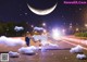 A woman laying on the ground in front of a full moon.